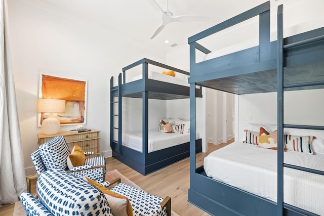 bedroom with light wood-type flooring and ceiling fan