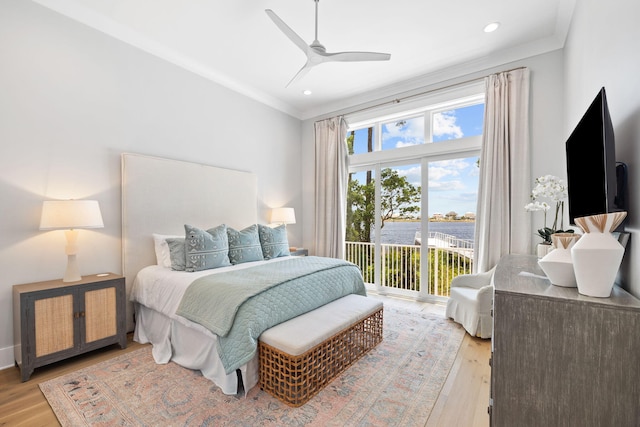 bedroom with ceiling fan, crown molding, access to outside, and light hardwood / wood-style flooring