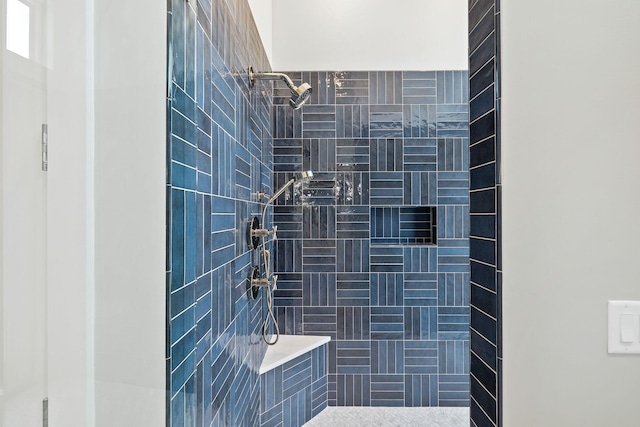 bathroom featuring a tile shower