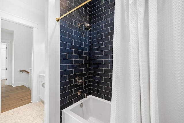 bathroom with shower / bath combination with curtain and hardwood / wood-style flooring