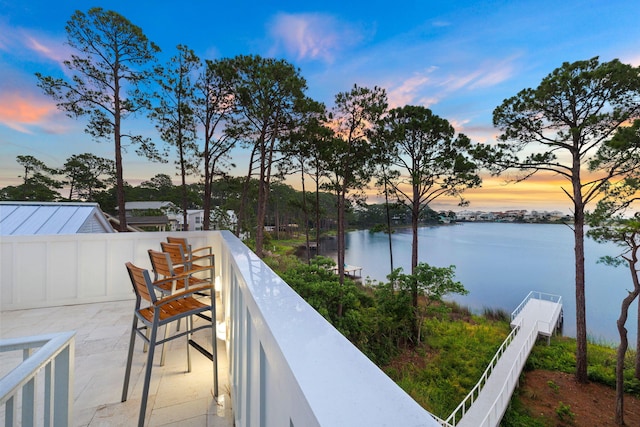 balcony at dusk with a water view