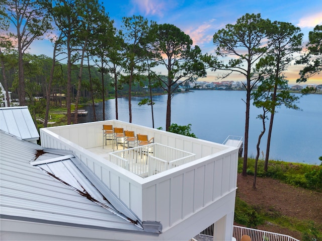 deck at dusk with a water view