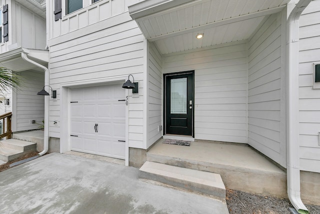 doorway to property featuring a garage