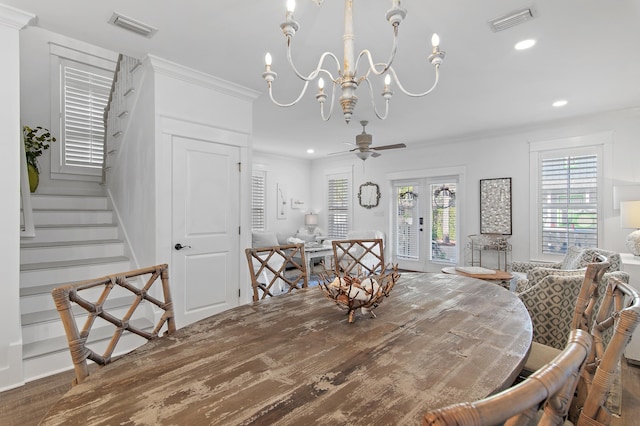 dining room featuring crown molding, french doors, and ceiling fan with notable chandelier