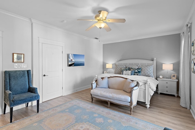 bedroom featuring light hardwood / wood-style flooring, ceiling fan, and ornamental molding