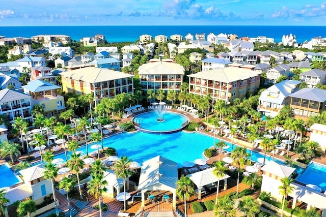 birds eye view of property with a water view