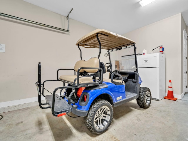 garage featuring white refrigerator