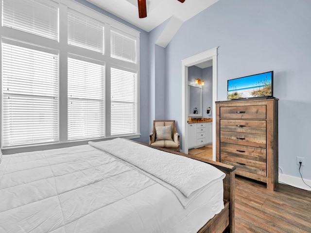 bedroom featuring ceiling fan, hardwood / wood-style floors, and lofted ceiling