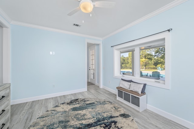 interior space featuring crown molding, ceiling fan, and light hardwood / wood-style floors