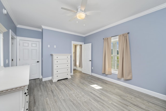 unfurnished bedroom with crown molding, ceiling fan, and light hardwood / wood-style floors