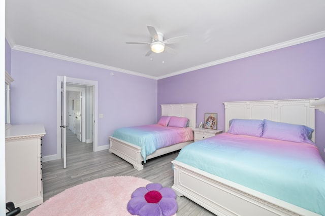 bedroom with light hardwood / wood-style flooring, ornamental molding, and ceiling fan