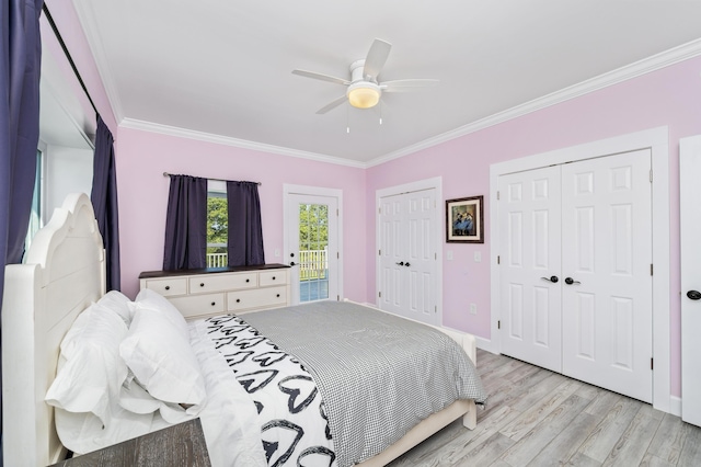 bedroom featuring crown molding, access to outside, light wood-type flooring, two closets, and ceiling fan