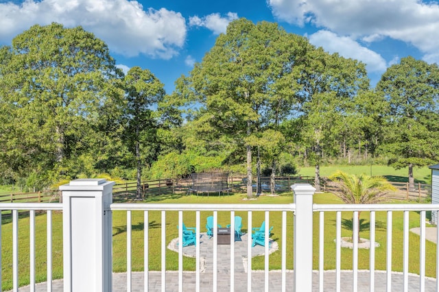 view of gate with a lawn