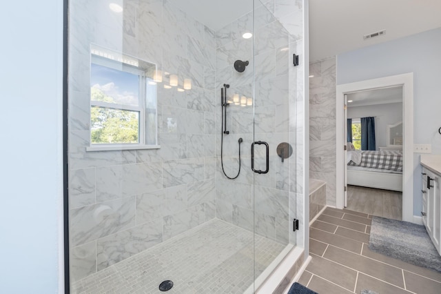 bathroom featuring vanity and an enclosed shower