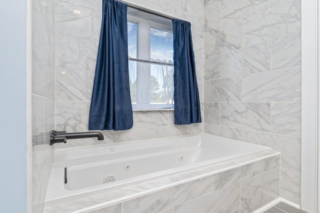 bathroom featuring tiled bath