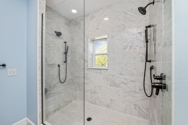 bathroom with tiled shower