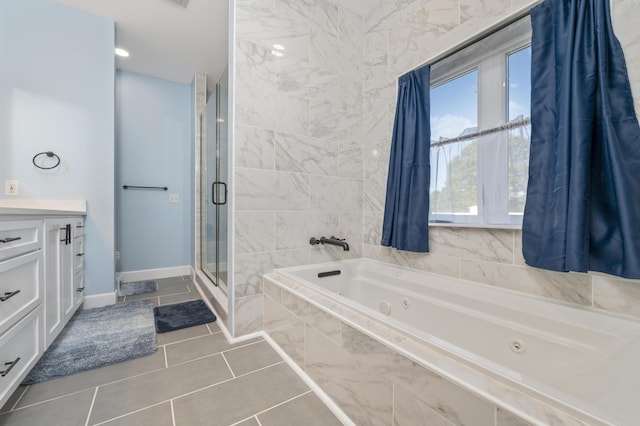 bathroom with tile patterned floors, vanity, and separate shower and tub