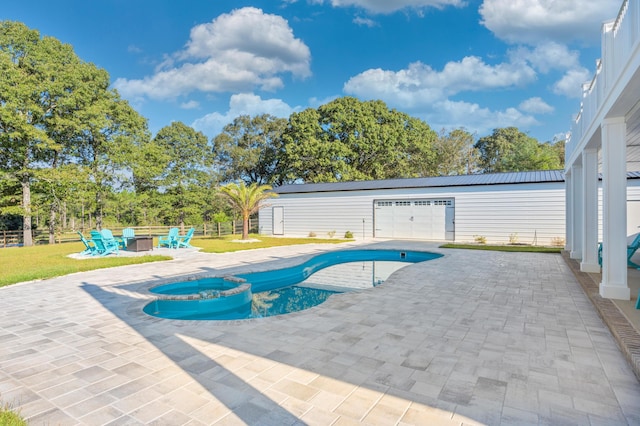 view of swimming pool with a patio area and an outdoor fire pit