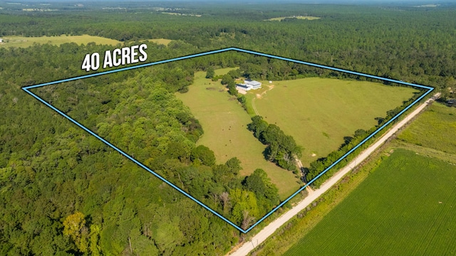 birds eye view of property featuring a rural view