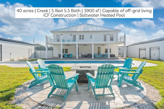 1921 Adams Dr, Defuniak Springs, FL 32433 - view of patio with an outdoor fire pit, a ceiling fan, and a balcony