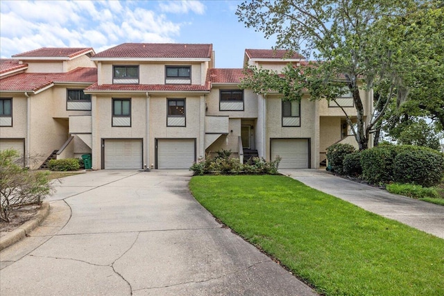 townhome / multi-family property featuring a garage