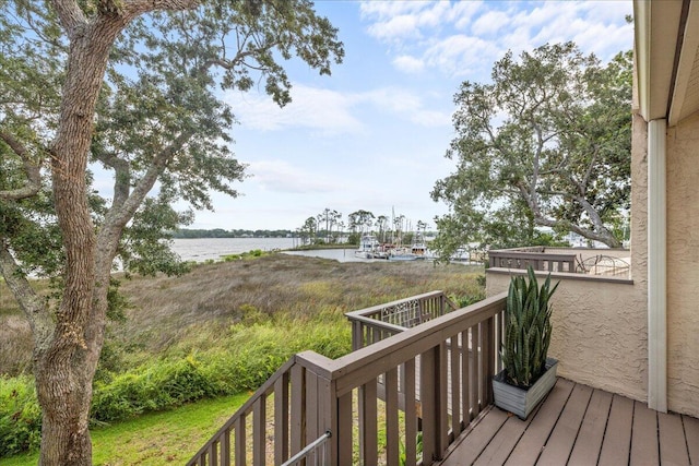 wooden deck featuring a water view