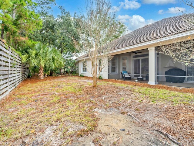 view of yard featuring a sunroom