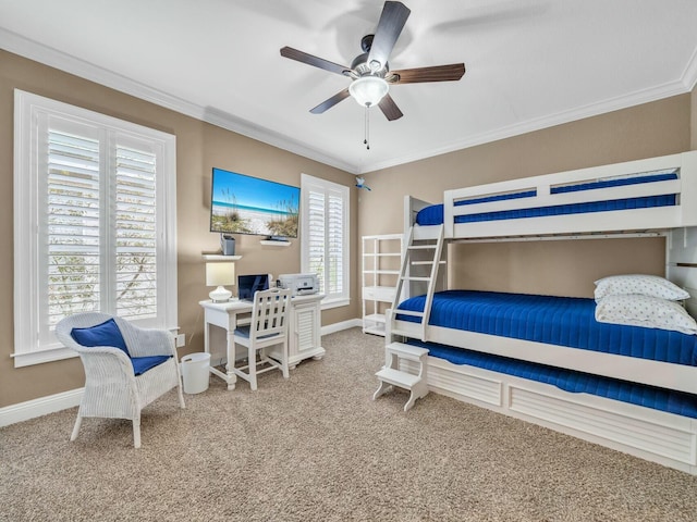 carpeted bedroom with ceiling fan and ornamental molding