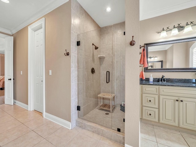 bathroom featuring tile patterned flooring, a shower with door, and crown molding