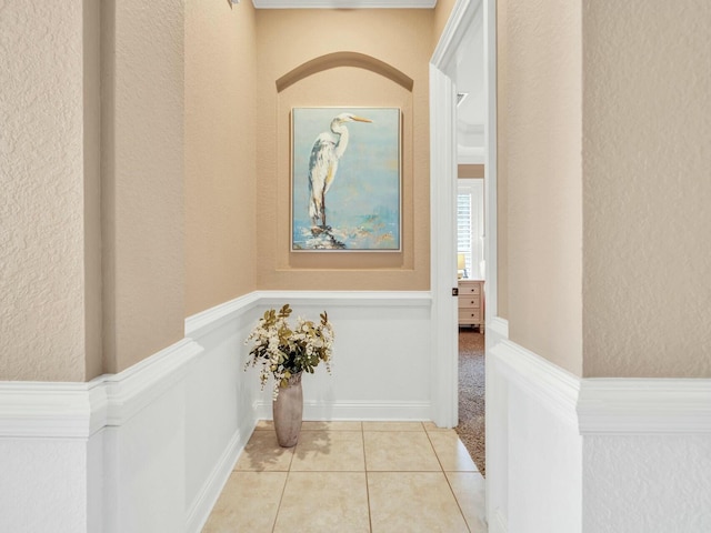 hallway featuring light tile patterned flooring