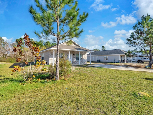 view of front of house with a porch and a front lawn