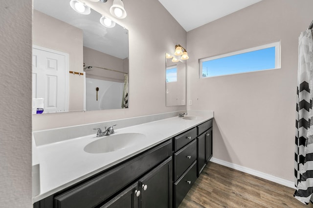 bathroom with a shower with shower curtain, vanity, and wood-type flooring