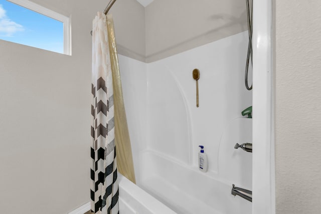 bathroom with shower / bath combo