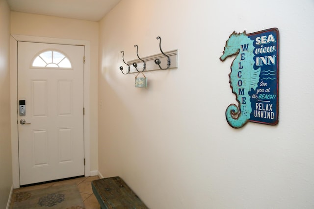 627 Eastern Lake Rd Unit 1, Santa Rosa Beach, FL 32459 - doorway to outside with tile patterned flooring and baseboards
