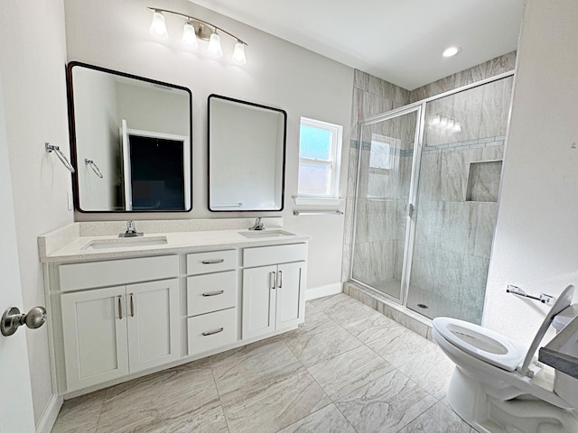 bathroom featuring vanity, toilet, and walk in shower