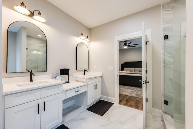 bathroom with vanity, a shower with door, and ceiling fan