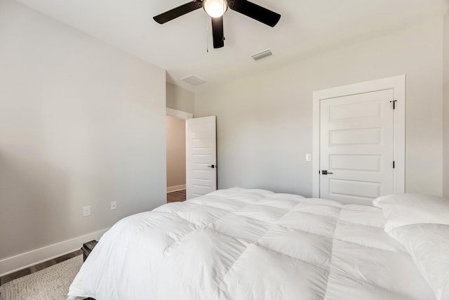 bedroom with hardwood / wood-style floors and ceiling fan