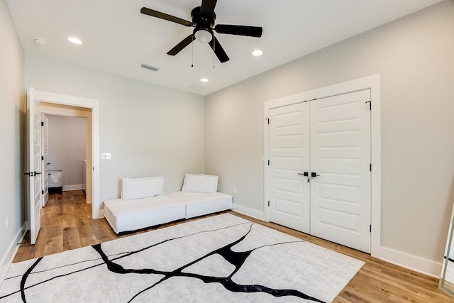 sitting room featuring ceiling fan and light hardwood / wood-style floors