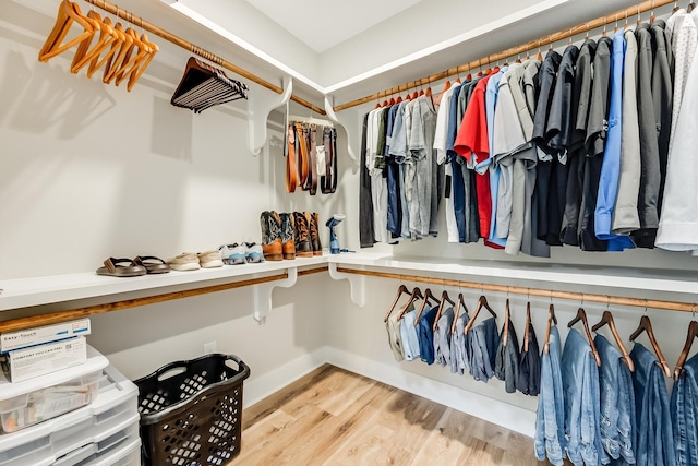 spacious closet with light hardwood / wood-style floors