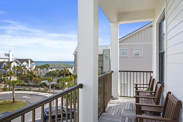 balcony featuring a water view