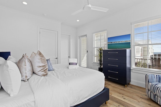 bedroom with ceiling fan, light hardwood / wood-style floors, and ornamental molding