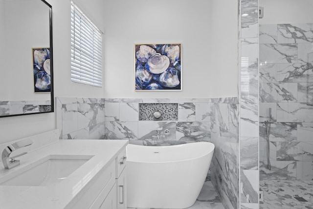 bathroom featuring vanity, tile walls, and independent shower and bath