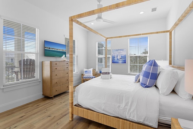 bedroom with hardwood / wood-style floors and ceiling fan