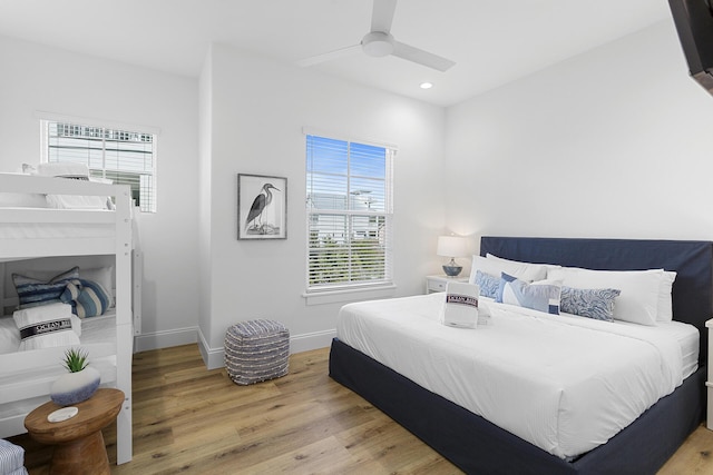 bedroom featuring light hardwood / wood-style flooring and ceiling fan