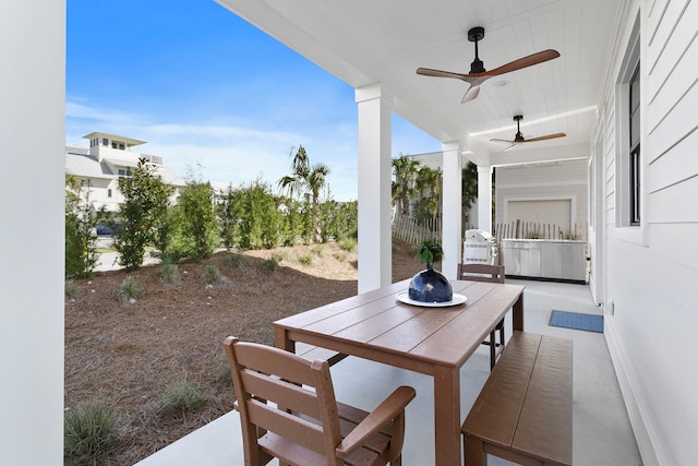 view of patio with area for grilling and ceiling fan