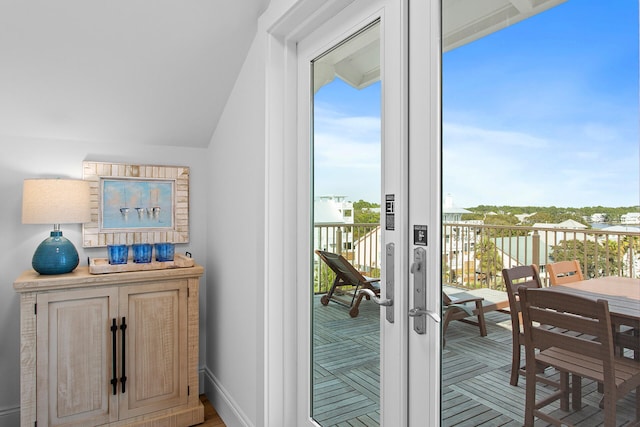 entryway featuring french doors and lofted ceiling