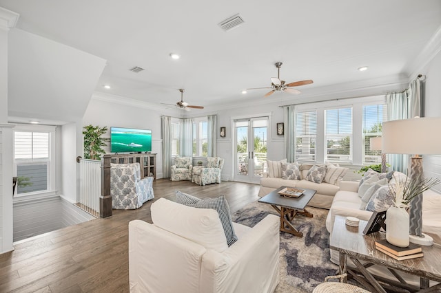 living room with ceiling fan, dark hardwood / wood-style flooring, and crown molding