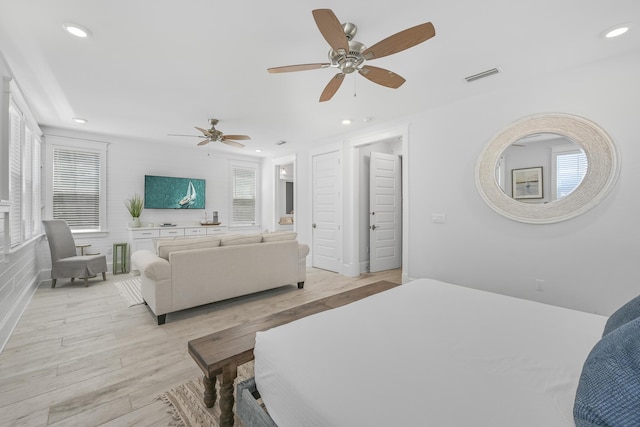 bedroom featuring light wood-type flooring and ceiling fan