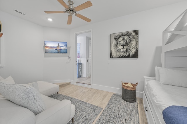 living room with ceiling fan and hardwood / wood-style flooring