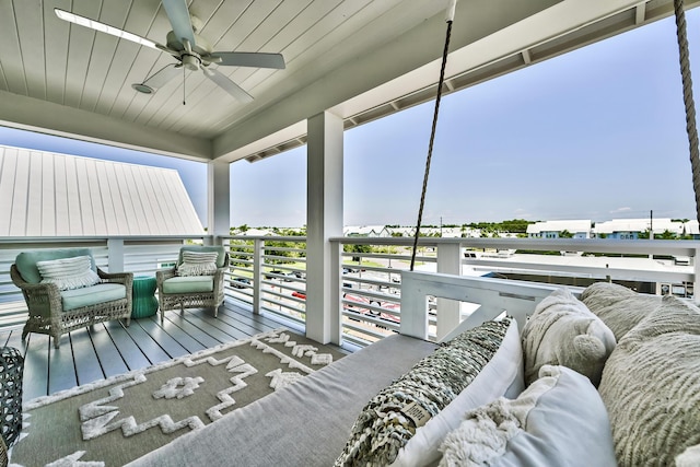 wooden terrace featuring ceiling fan